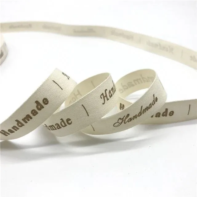 Хлопковая лента с надписью Hand Made 1,5см цв.ванильный (10 этикеток) НМ-04 для кукол
